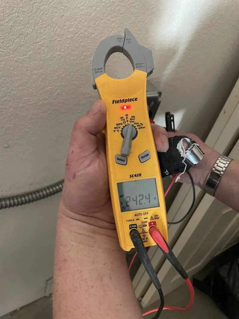 Voltage testing with clamp meter during Generator Installation in Schuyler